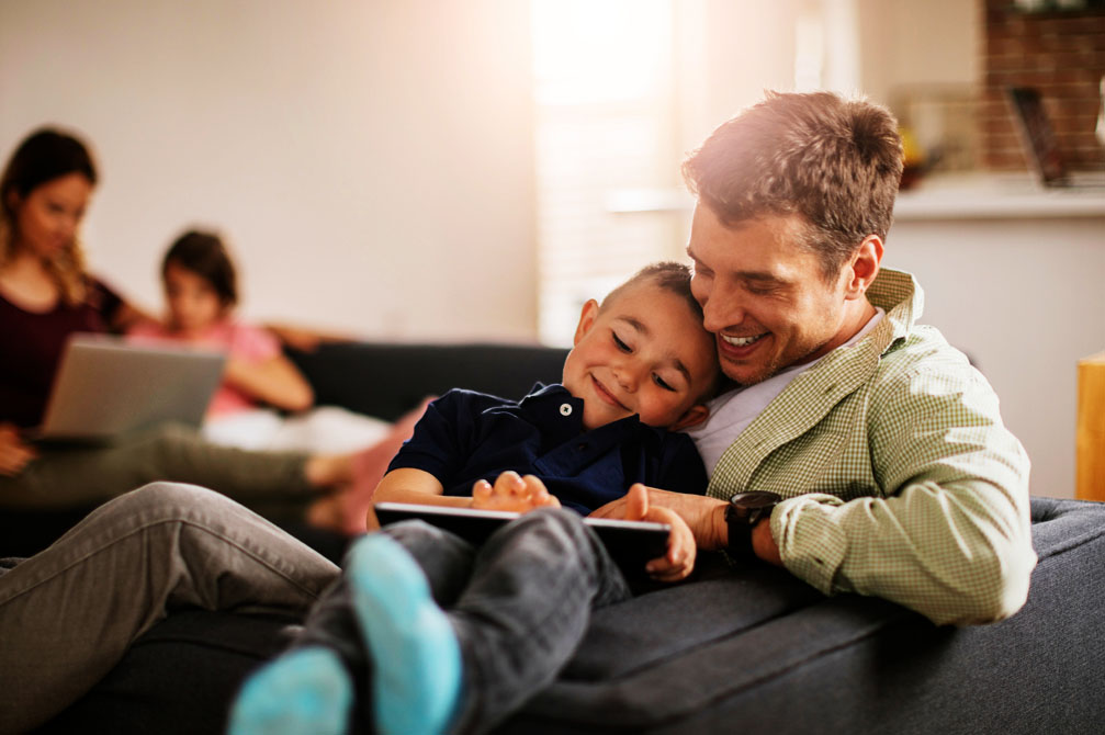 Father and son in home