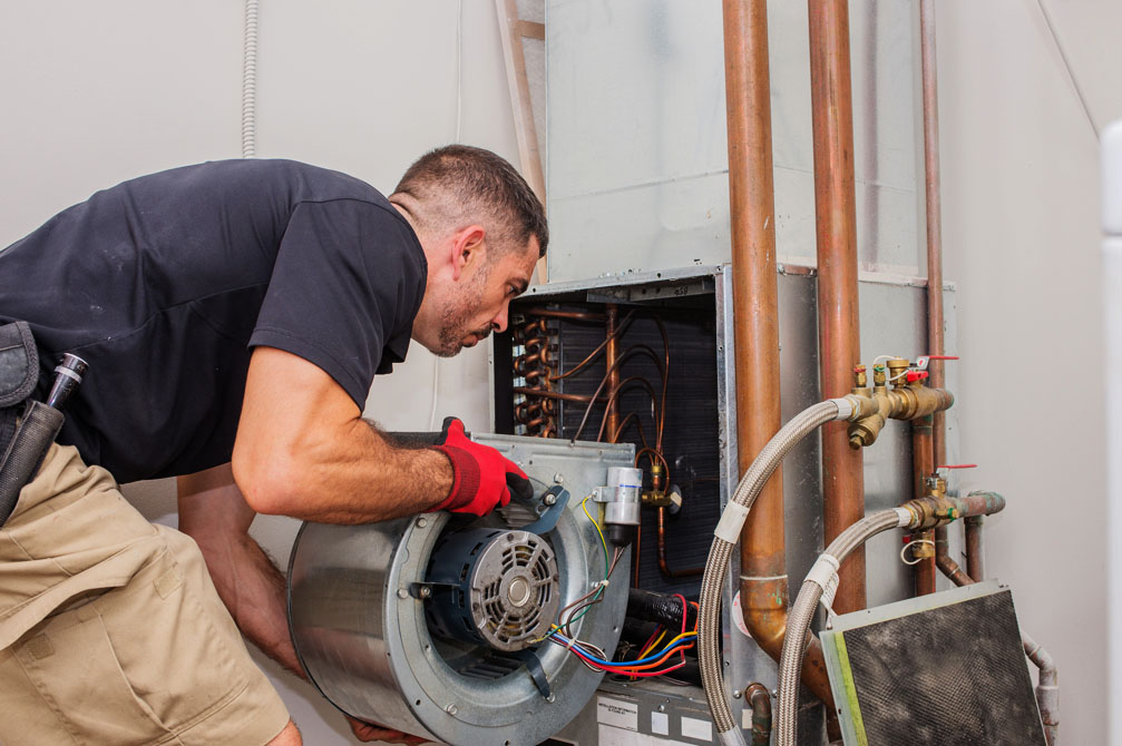Heating Installation Technician installing furnace