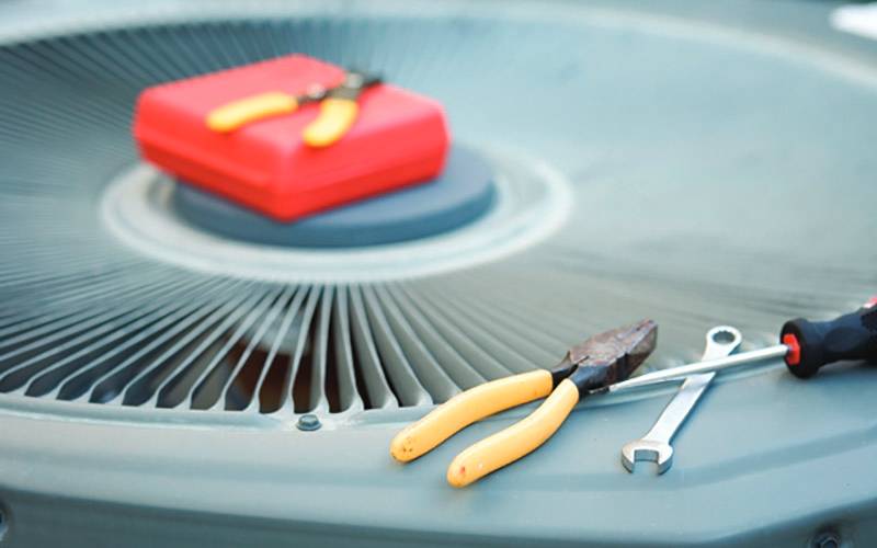 air conditioner with toolkit on top